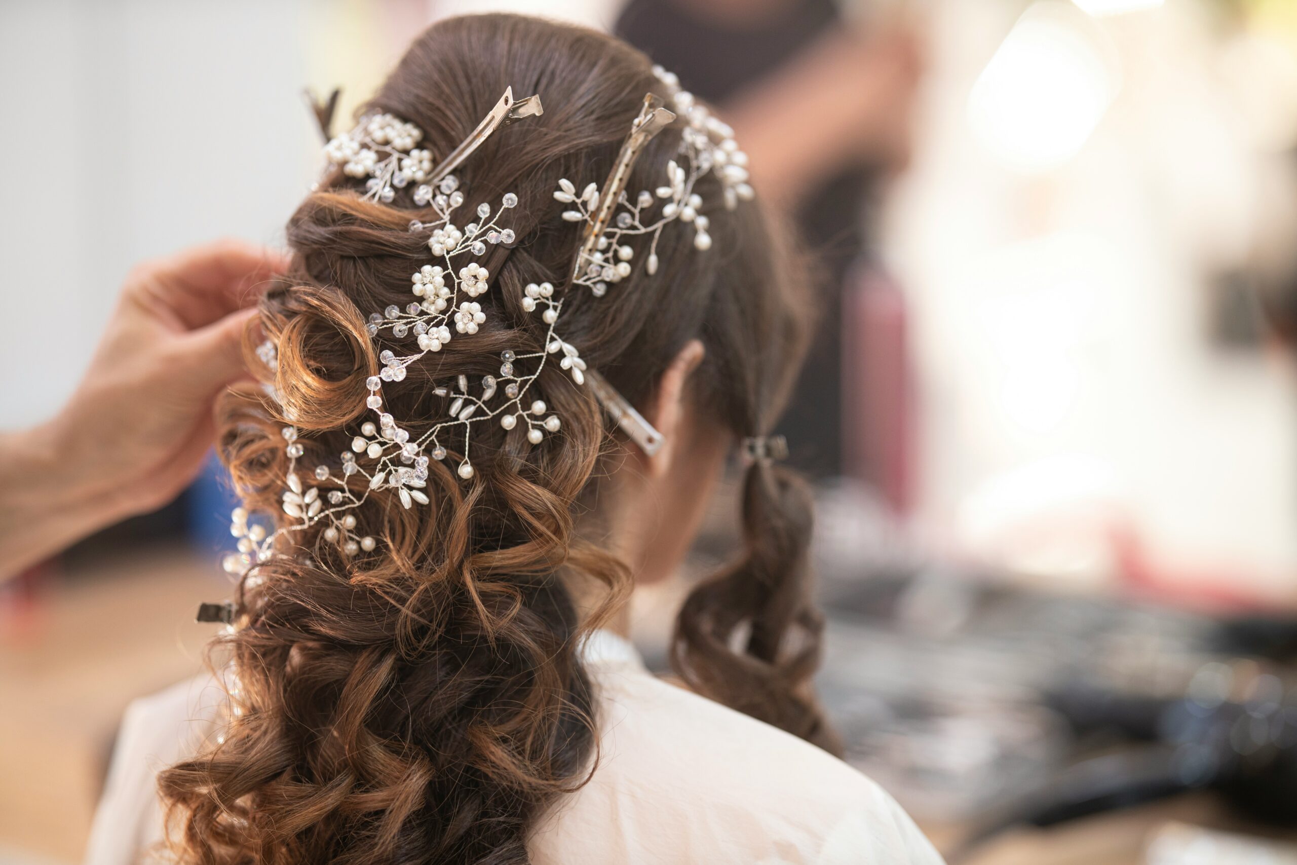 An elegant bride experiencing a professional wedding hair trial consultation at a boutique luxury salon in Westchester.