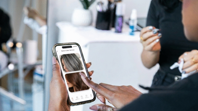Stylist discussing gray blending vs full coverage color options during a client consultation at a boutique salon.